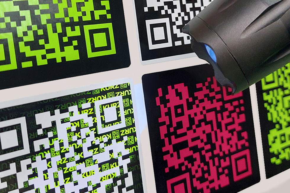 QR codes with UV security features, applied using thermal transfer process